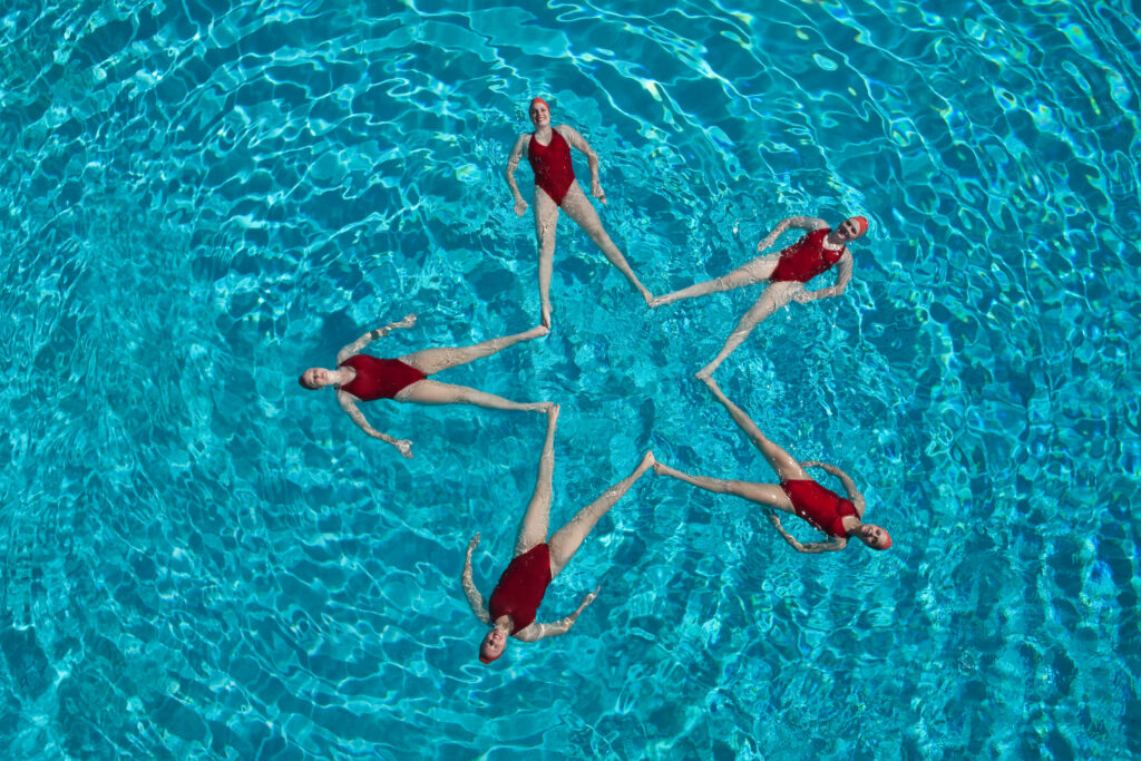 Synchronised Swimmers Forming A Star Shape