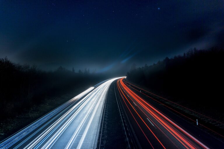 Long exposure shot of car lights on the highway at night.